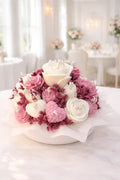 Ramo floral de cera en tonos rosa empolvado y blanco